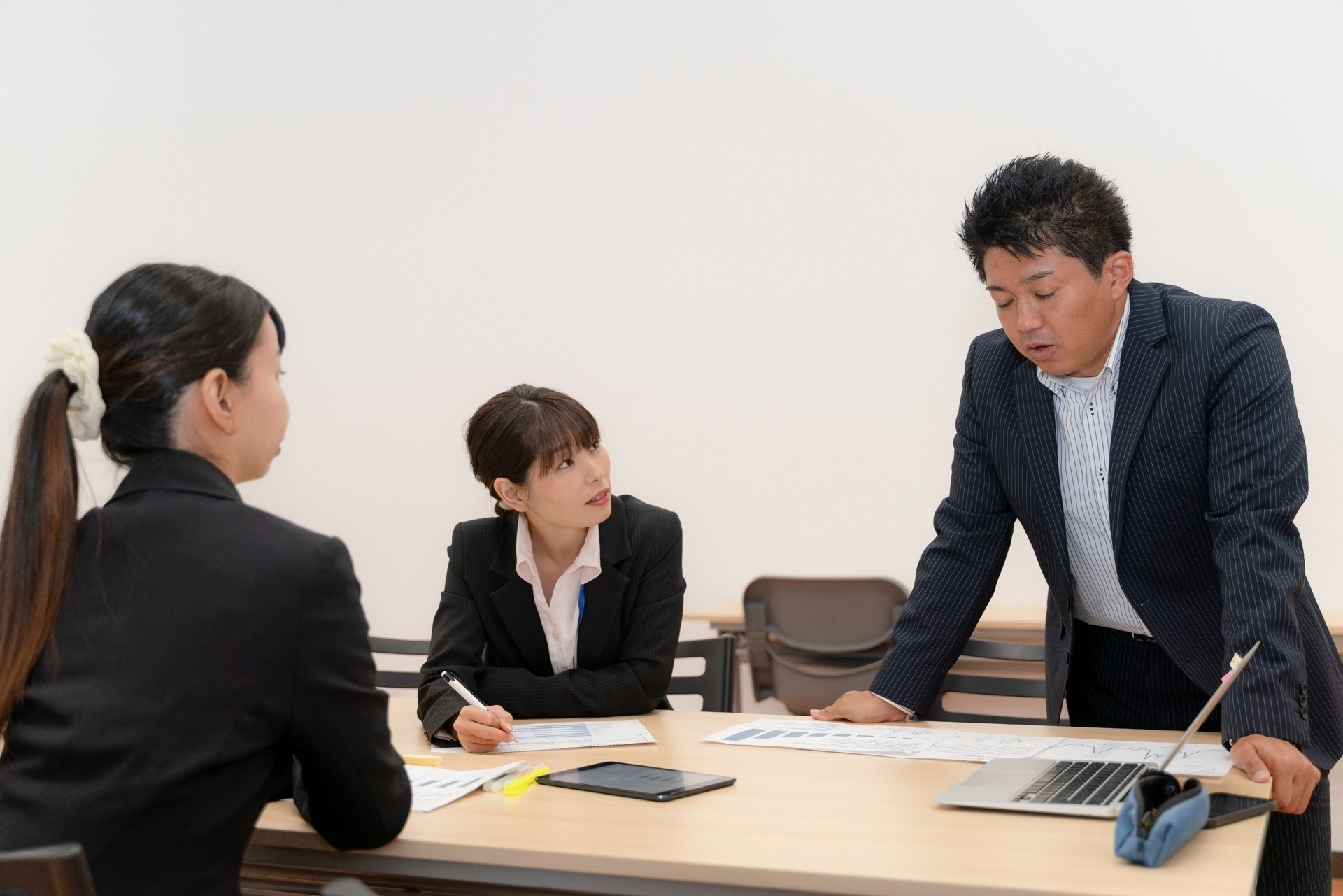 Female employees receiving training from male employees